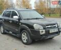 Черный Хендай Туксон, объемом двигателя 2 л и пробегом 270 тыс. км за 6800 $, фото 1 на Automoto.ua