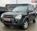 Черный Хендай Туксон, объемом двигателя 2 л и пробегом 163 тыс. км за 7690 $, фото 1 на Automoto.ua
