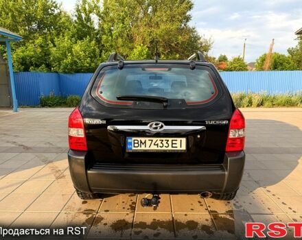 Черный Хендай Туксон, объемом двигателя 2 л и пробегом 200 тыс. км за 7400 $, фото 4 на Automoto.ua