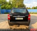 Черный Хендай Туксон, объемом двигателя 2 л и пробегом 200 тыс. км за 7400 $, фото 4 на Automoto.ua