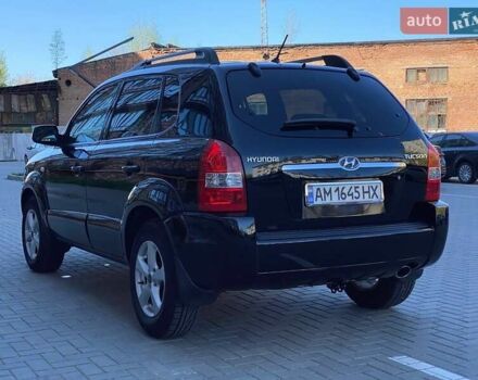 Черный Хендай Туксон, объемом двигателя 1.98 л и пробегом 286 тыс. км за 7300 $, фото 6 на Automoto.ua