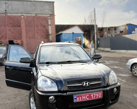 Черный Хендай Туксон, объемом двигателя 1.98 л и пробегом 230 тыс. км за 7750 $, фото 1 на Automoto.ua