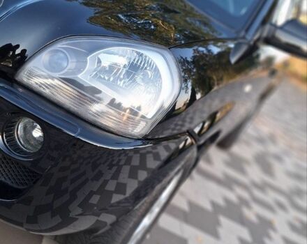 Чорний Хендай Туксон, об'ємом двигуна 2 л та пробігом 190 тис. км за 8300 $, фото 6 на Automoto.ua