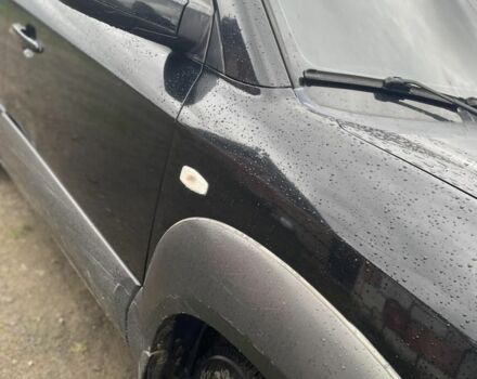 Чорний Хендай Туксон, об'ємом двигуна 2 л та пробігом 230 тис. км за 5999 $, фото 1 на Automoto.ua