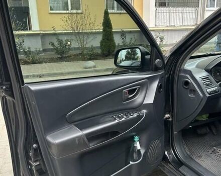 Черный Хендай Туксон, объемом двигателя 1.98 л и пробегом 147 тыс. км за 8000 $, фото 4 на Automoto.ua