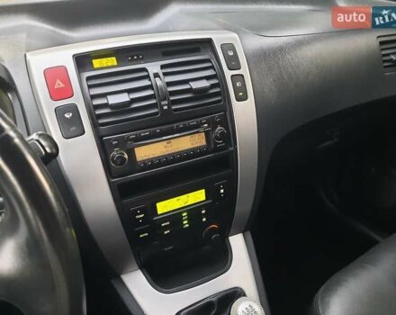 Черный Хендай Туксон, объемом двигателя 2 л и пробегом 219 тыс. км за 7990 $, фото 118 на Automoto.ua