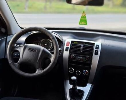 Черный Хендай Туксон, объемом двигателя 2 л и пробегом 190 тыс. км за 8150 $, фото 31 на Automoto.ua