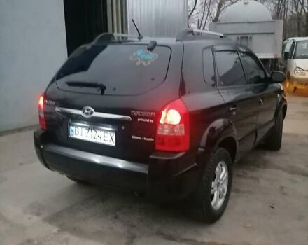 Черный Хендай Туксон, объемом двигателя 1.98 л и пробегом 238 тыс. км за 8400 $, фото 5 на Automoto.ua