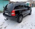Черный Хендай Туксон, объемом двигателя 2 л и пробегом 260 тыс. км за 7900 $, фото 6 на Automoto.ua