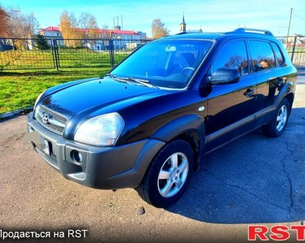 Черный Хендай Туксон, объемом двигателя 2 л и пробегом 227 тыс. км за 7750 $, фото 1 на Automoto.ua