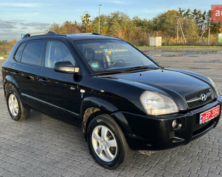 Черный Хендай Туксон, объемом двигателя 1.98 л и пробегом 243 тыс. км за 8500 $, фото 1 на Automoto.ua