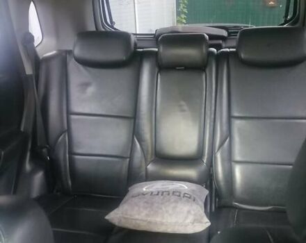 Черный Хендай Туксон, объемом двигателя 1.98 л и пробегом 238 тыс. км за 8400 $, фото 10 на Automoto.ua