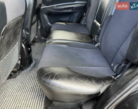 Черный Хендай Туксон, объемом двигателя 2 л и пробегом 300 тыс. км за 7350 $, фото 63 на Automoto.ua