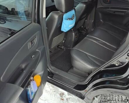 Черный Хендай Туксон, объемом двигателя 1.98 л и пробегом 335 тыс. км за 7800 $, фото 9 на Automoto.ua