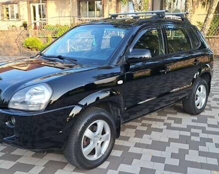 Черный Хендай Туксон, объемом двигателя 2 л и пробегом 190 тыс. км за 8150 $, фото 1 на Automoto.ua