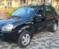 Черный Хендай Туксон, объемом двигателя 2 л и пробегом 190 тыс. км за 8150 $, фото 1 на Automoto.ua