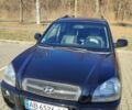 Черный Хендай Туксон, объемом двигателя 1.98 л и пробегом 210 тыс. км за 7200 $, фото 3 на Automoto.ua