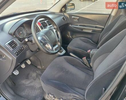 Черный Хендай Туксон, объемом двигателя 2 л и пробегом 280 тыс. км за 6700 $, фото 16 на Automoto.ua