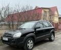 Черный Хендай Туксон, объемом двигателя 2 л и пробегом 280 тыс. км за 6600 $, фото 1 на Automoto.ua