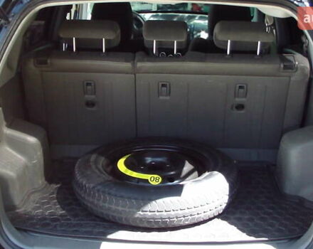 Черный Хендай Туксон, объемом двигателя 1.98 л и пробегом 234 тыс. км за 7800 $, фото 4 на Automoto.ua