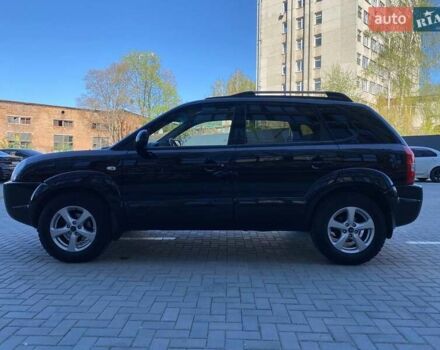 Черный Хендай Туксон, объемом двигателя 1.98 л и пробегом 286 тыс. км за 7300 $, фото 11 на Automoto.ua