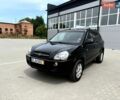 Черный Хендай Туксон, объемом двигателя 2 л и пробегом 235 тыс. км за 8500 $, фото 1 на Automoto.ua