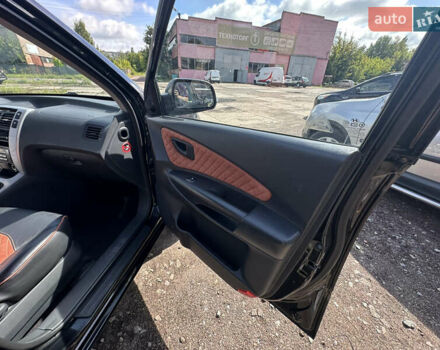 Черный Хендай Туксон, объемом двигателя 2 л и пробегом 198 тыс. км за 8600 $, фото 32 на Automoto.ua