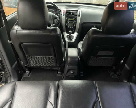 Черный Хендай Туксон, объемом двигателя 2 л и пробегом 180 тыс. км за 7700 $, фото 27 на Automoto.ua