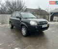 Черный Хендай Туксон, объемом двигателя 2 л и пробегом 225 тыс. км за 5000 $, фото 1 на Automoto.ua