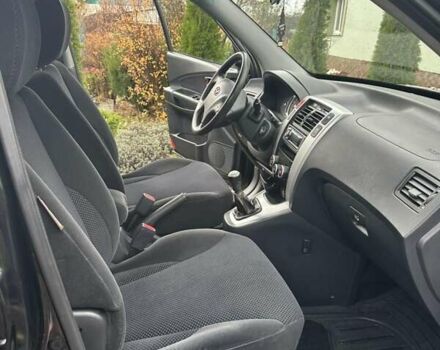 Черный Хендай Туксон, объемом двигателя 2 л и пробегом 218 тыс. км за 7600 $, фото 1 на Automoto.ua