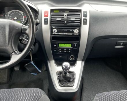 Черный Хендай Туксон, объемом двигателя 2 л и пробегом 330 тыс. км за 4350 $, фото 16 на Automoto.ua