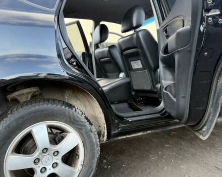 Черный Хендай Туксон, объемом двигателя 1.98 л и пробегом 230 тыс. км за 7750 $, фото 12 на Automoto.ua