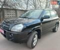 Черный Хендай Туксон, объемом двигателя 2 л и пробегом 246 тыс. км за 8550 $, фото 1 на Automoto.ua