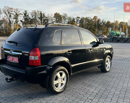 Черный Хендай Туксон, объемом двигателя 1.98 л и пробегом 243 тыс. км за 8500 $, фото 7 на Automoto.ua