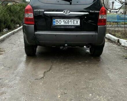 Черный Хендай Туксон, объемом двигателя 1.98 л и пробегом 273 тыс. км за 7400 $, фото 6 на Automoto.ua