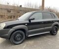 Черный Хендай Туксон, объемом двигателя 2 л и пробегом 330 тыс. км за 4350 $, фото 3 на Automoto.ua