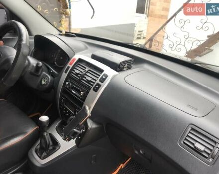 Черный Хендай Туксон, объемом двигателя 2 л и пробегом 210 тыс. км за 8999 $, фото 56 на Automoto.ua