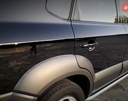 Черный Хендай Туксон, объемом двигателя 2 л и пробегом 230 тыс. км за 8600 $, фото 63 на Automoto.ua