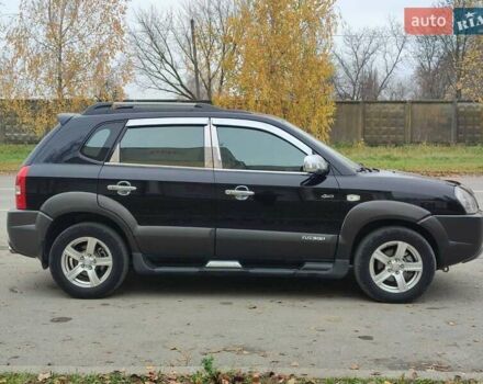 Черный Хендай Туксон, объемом двигателя 2 л и пробегом 270 тыс. км за 6800 $, фото 5 на Automoto.ua