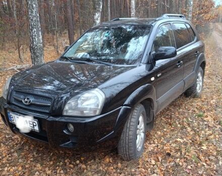 Черный Хендай Туксон, объемом двигателя 2 л и пробегом 240 тыс. км за 8800 $, фото 1 на Automoto.ua