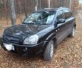 Черный Хендай Туксон, объемом двигателя 2 л и пробегом 240 тыс. км за 8800 $, фото 1 на Automoto.ua