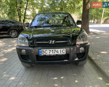 Черный Хендай Туксон, объемом двигателя 1.98 л и пробегом 232 тыс. км за 9100 $, фото 1 на Automoto.ua