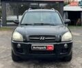 Черный Хендай Туксон, объемом двигателя 2 л и пробегом 177 тыс. км за 8940 $, фото 2 на Automoto.ua