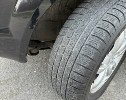 Черный Хендай Туксон, объемом двигателя 1.98 л и пробегом 159 тыс. км за 7600 $, фото 41 на Automoto.ua