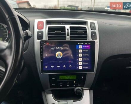 Черный Хендай Туксон, объемом двигателя 2 л и пробегом 163 тыс. км за 7690 $, фото 35 на Automoto.ua