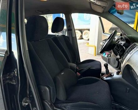 Черный Хендай Туксон, объемом двигателя 2 л и пробегом 310 тыс. км за 6499 $, фото 11 на Automoto.ua