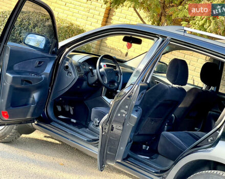 Черный Хендай Туксон, объемом двигателя 2 л и пробегом 167 тыс. км за 7800 $, фото 7 на Automoto.ua