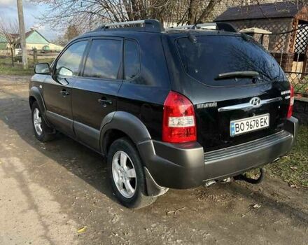 Черный Хендай Туксон, объемом двигателя 1.99 л и пробегом 302 тыс. км за 6900 $, фото 5 на Automoto.ua