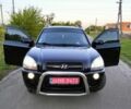 Черный Хендай Туксон, объемом двигателя 2 л и пробегом 165 тыс. км за 9850 $, фото 1 на Automoto.ua