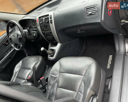 Черный Хендай Туксон, объемом двигателя 2 л и пробегом 180 тыс. км за 7700 $, фото 31 на Automoto.ua